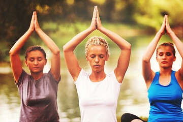 Image showing women meditating and doing yoga exercise