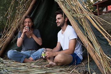 Image showing couple spending time together in straw tent