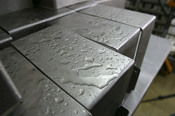 Image showing cheese moulds in modern dairy factory