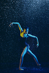 Image showing Two young female ballet dancers under water drops