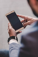 Image showing Close up of businessman using mobile smart phone.