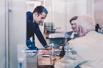 Image showing Business people sitting and brainstorming at corporate meeting.