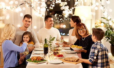 Image showing happy family having dinner party at home