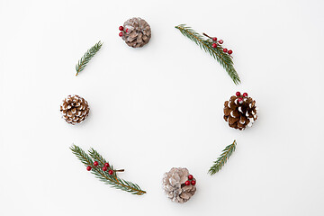 Image showing christmas frame of fir branches with pine cones