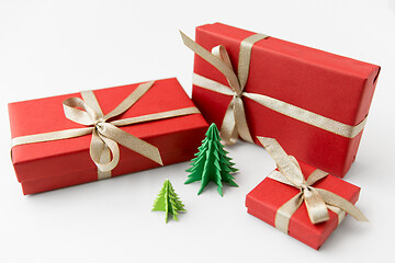 Image showing gift boxes and christmas trees on white background