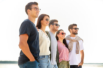 Image showing happy friends on summer beach