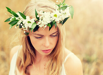 Image showing happy woman in wreath of flowers