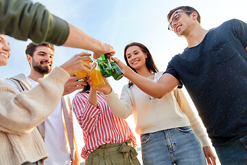 Image showing friends toasting non alcoholic drinks on beach