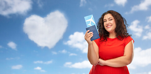 Image showing happy woman with passport and air ticket