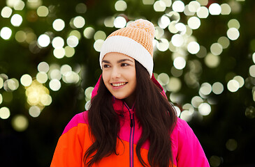 Image showing happy young woman in winter clothes outdoors