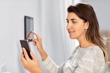 Image showing woman using tablet computer and smartphone