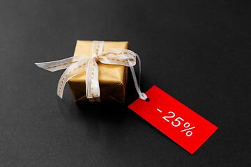 Image showing small gift box and red sale tag with discount sign