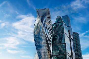 Image showing Skyscraper and cloudy blue sky background