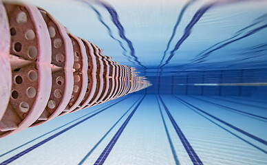 Image showing Olympic Swimming pool under water background.