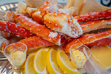 Image showing Red king crab legs with fresh lemon slices