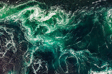 Image showing Waves of water of the river and the sea meet each