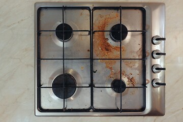 Image showing Dirty stove in a kitchen