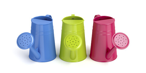 Image showing Three colorful watering cans