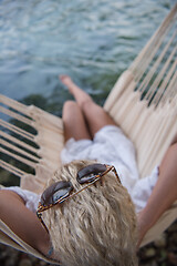 Image showing blonde woman resting on hammock