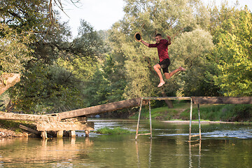 Image showing man jumping into the river