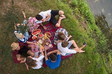 Image showing top view of group friends enjoying picnic time