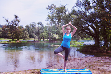 Image showing woman meditating and doing yoga exercise