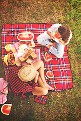 Image showing top view of couple enjoying picnic time