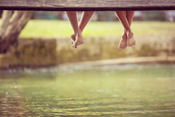 Image showing people sitting at wooden bridge