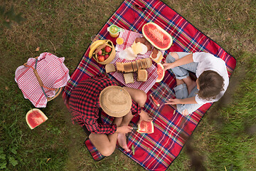 Image showing top view of couple enjoying picnic time