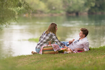 Image showing Couple in love enjoying picnic time