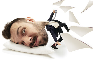 Image showing Big head on small body lying on the pillow