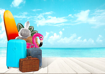 Image showing Collage of luggage for travel in front of ocean view