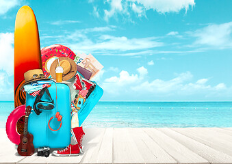 Image showing Collage of luggage for travel in front of ocean view