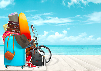 Image showing Collage of luggage for travel in front of ocean view