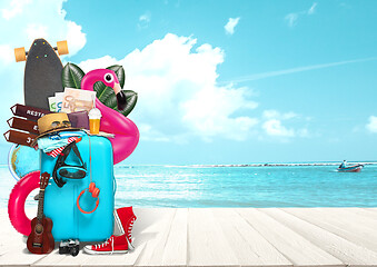 Image showing Collage of luggage for travel in front of ocean view