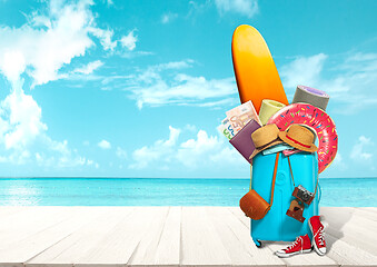 Image showing Collage of luggage for travel in front of ocean view