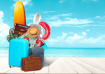 Image showing Collage of luggage for travel in front of ocean view