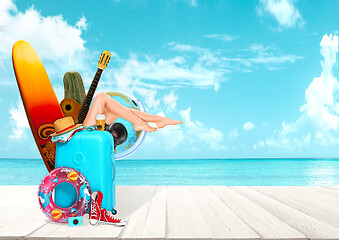 Image showing Collage of luggage for travel in front of ocean view