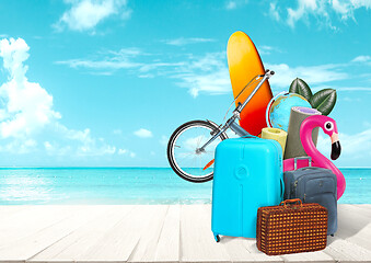 Image showing Collage of luggage for travel in front of ocean view