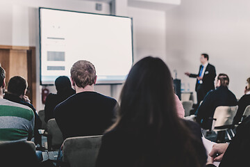 Image showing Business speaker giving a talk at business conference event.