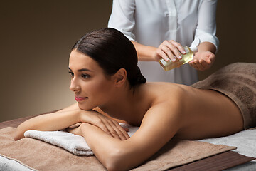 Image showing beautiful woman having back massage at spa