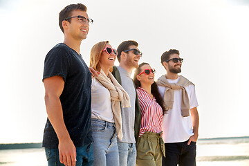 Image showing happy friends on summer beach