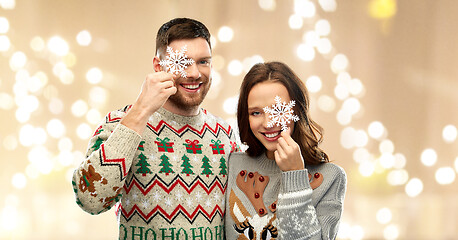 Image showing happy couple at christmas ugly sweater party