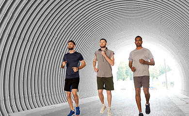 Image showing young men or male friends running outdoors