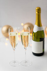 Image showing two glasses of champagne and bottle on christmas