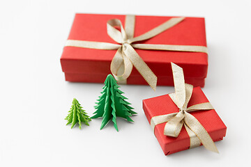 Image showing gift boxes and christmas trees on white background