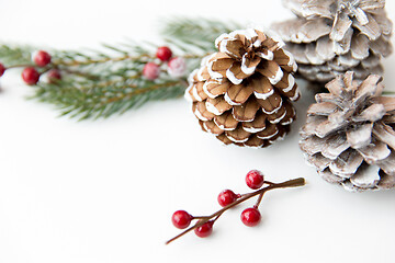 Image showing christmas balls and fir branches with pine cones