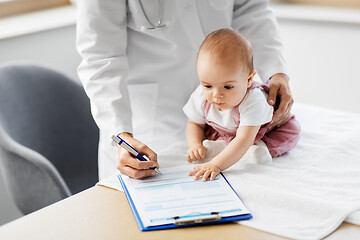 Image showing female pediatrician doctor with baby at clinic