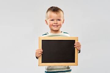 Image showing portrait of smiling boy holding black chalk board