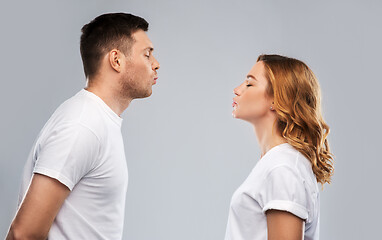 Image showing couple in white t-shirts ready for kiss